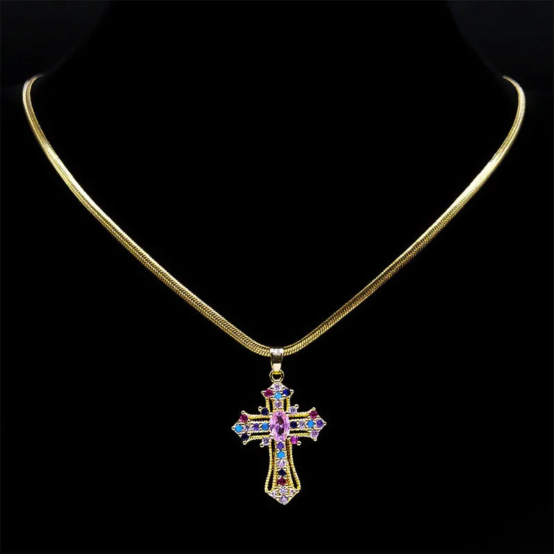 Gold necklace with a cross pendant on a black background