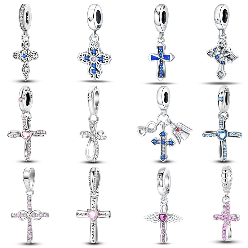 Collection of silver pendants with various designs on a white background