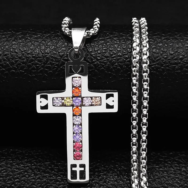 Cross pendant with colorful stones on a chain against