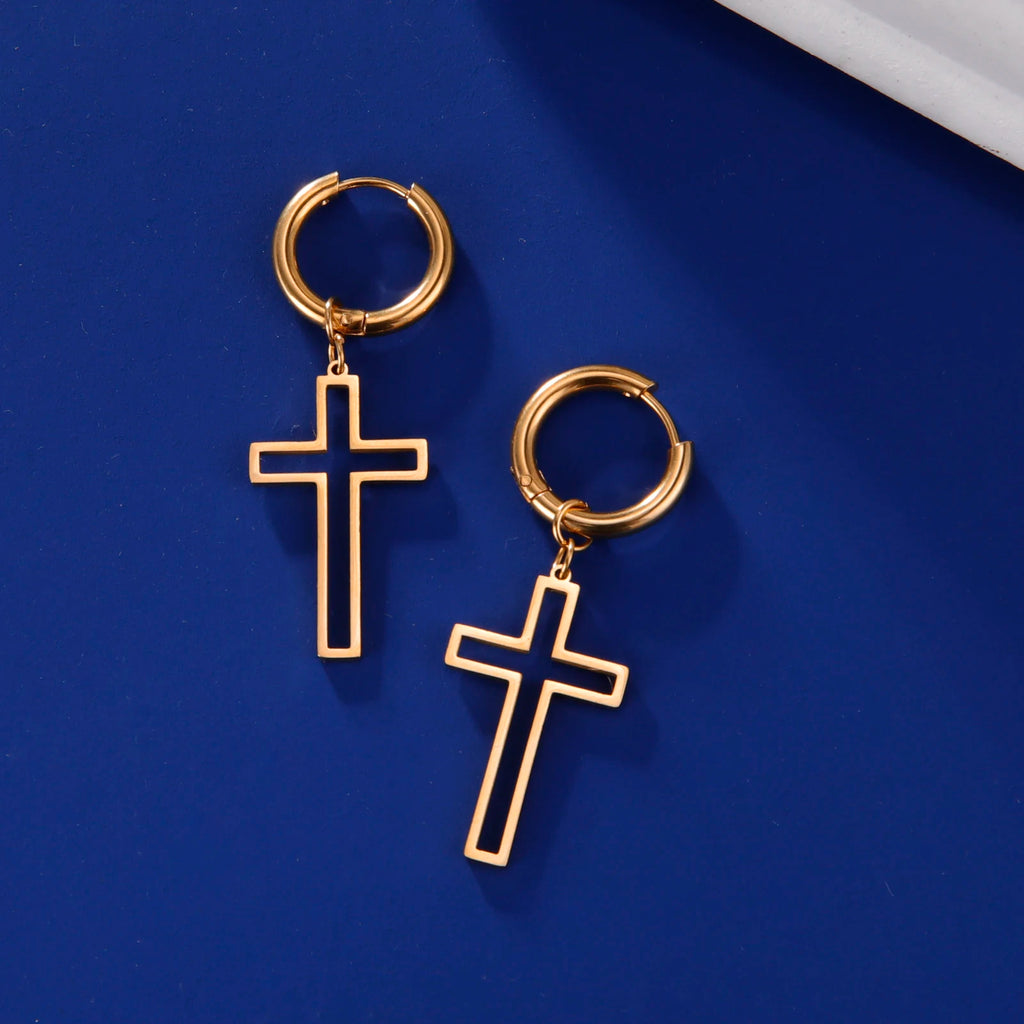 Gold hoop earrings with cross designs on a blue background