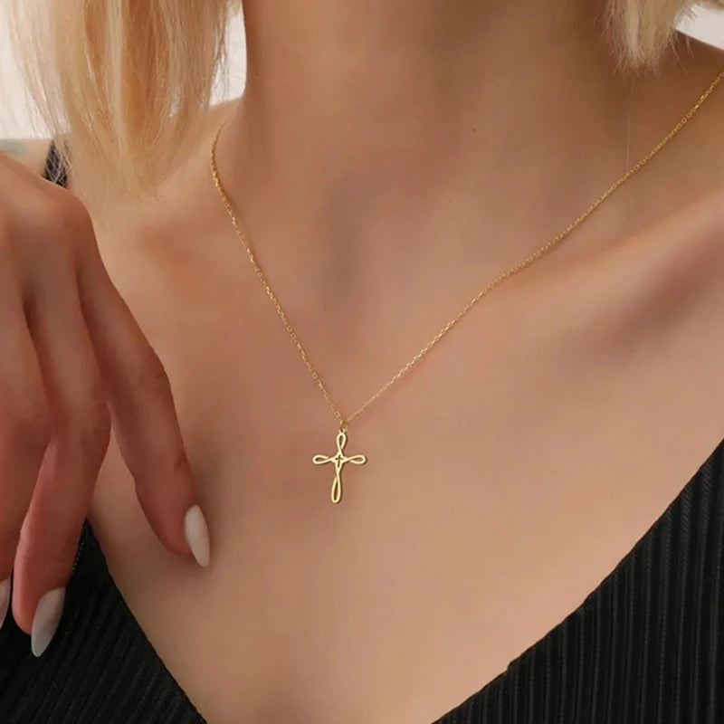 Gold colour cross necklace, sound charged.