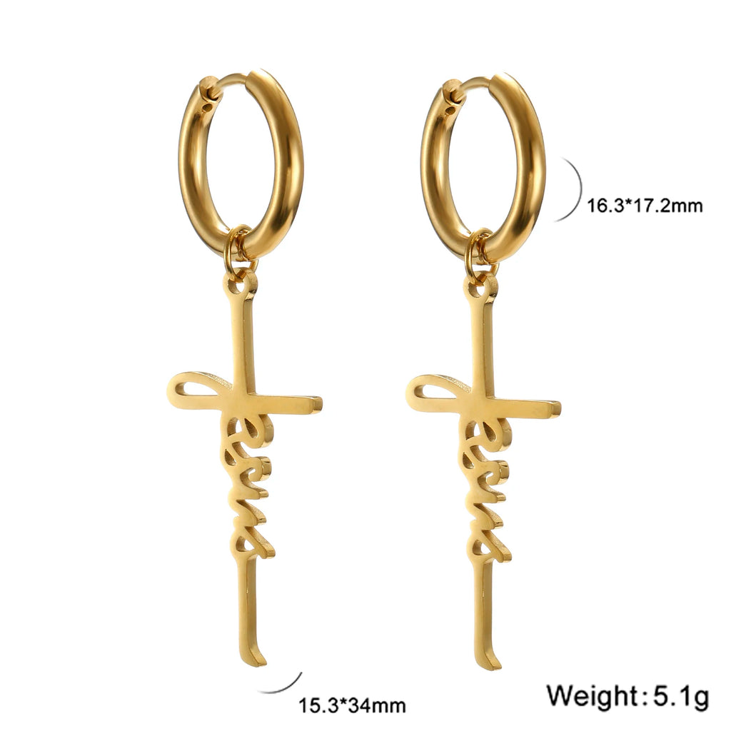 Gold hoop earrings with cross-shaped pendants on a white background