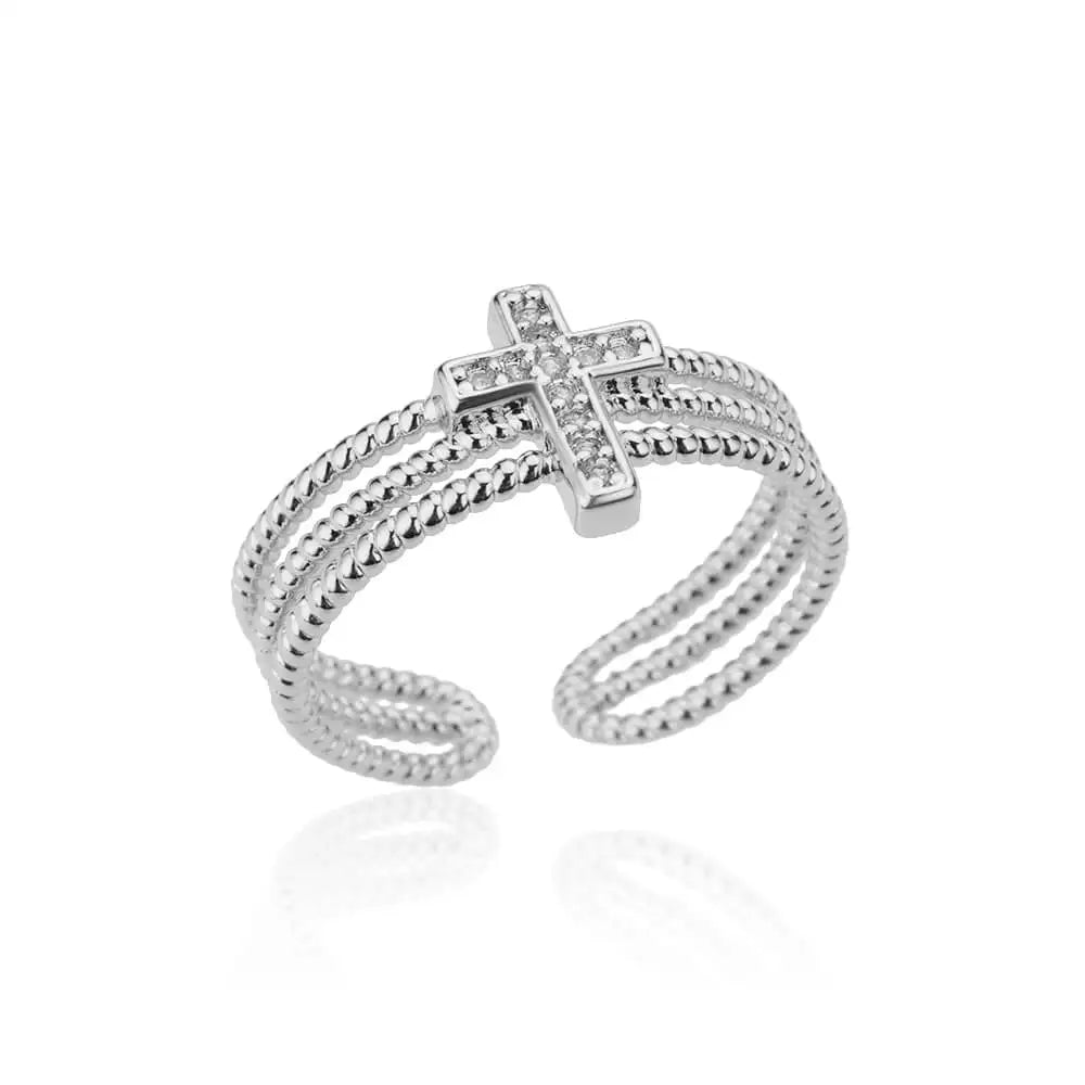 Silver cross-shaped ring on a white background