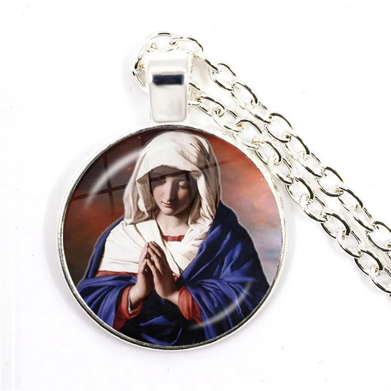 Pendant with a religious figure on a chain against a white background