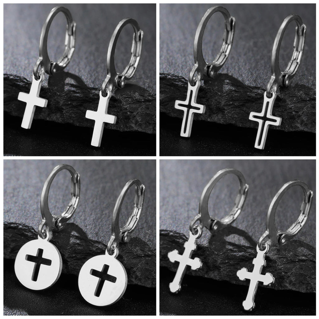 Silver hoop earrings with cross charms on a dark background