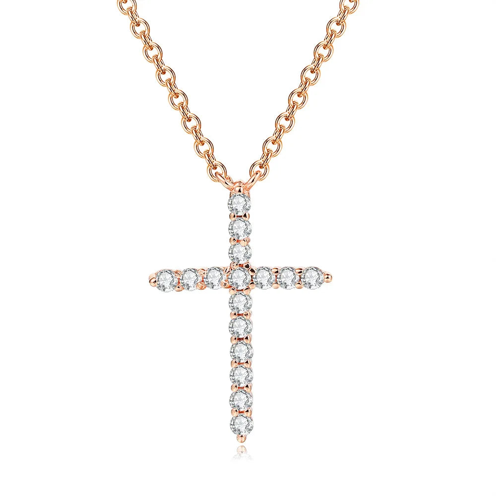 Rose gold cross necklace with diamonds on a white background