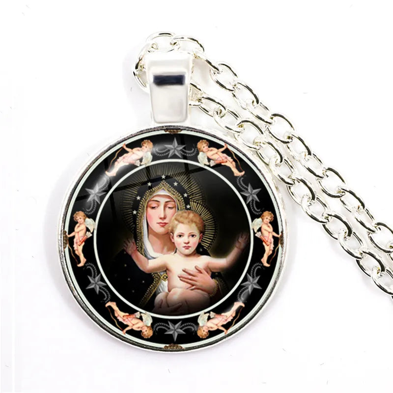 Pendant with religious design featuring a woman and child, surrounded by cherubs, on a white background.