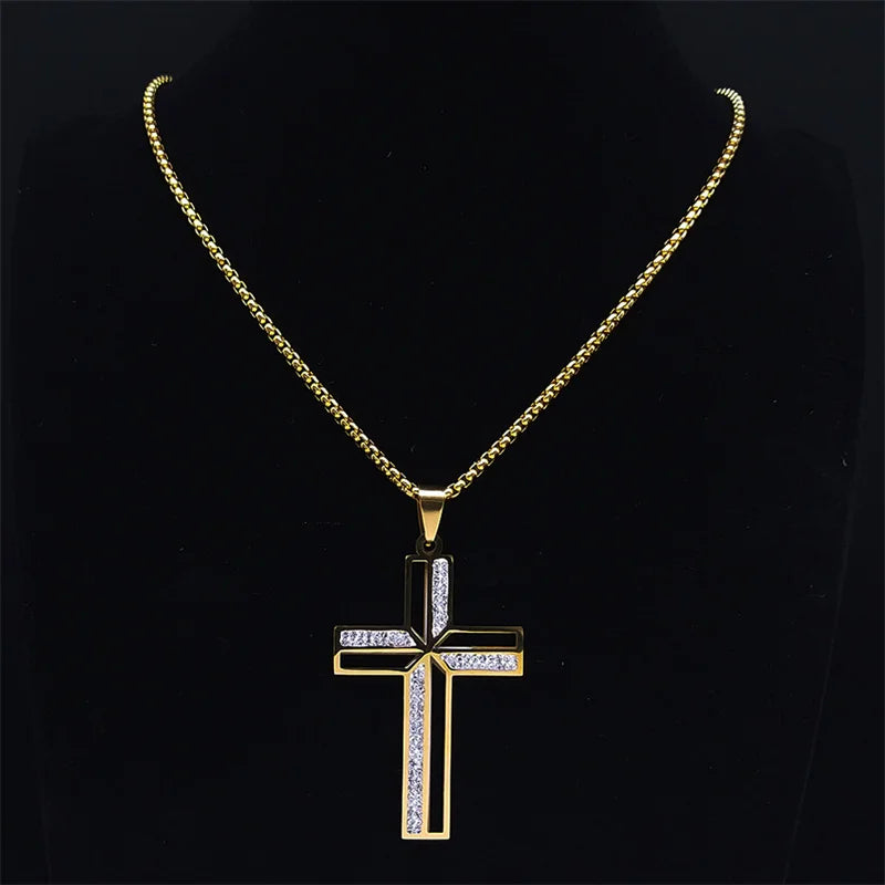 Gold cross pendant necklace on a black background
