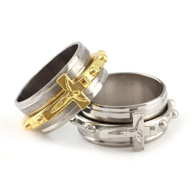 Two rings with cross designs on a white background