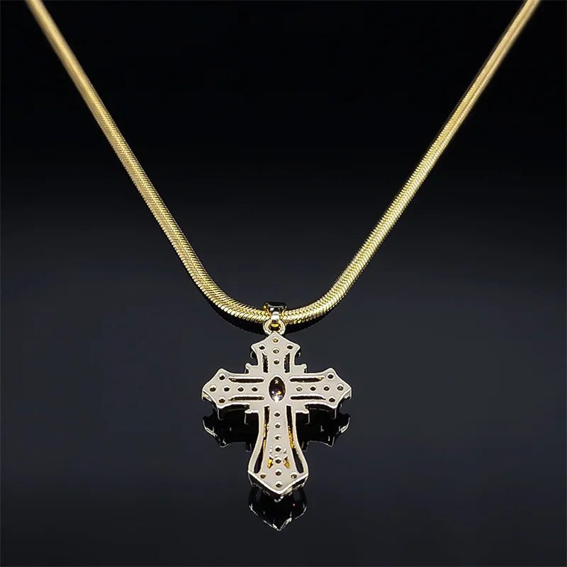 Gold necklace with a cross pendant on a black background