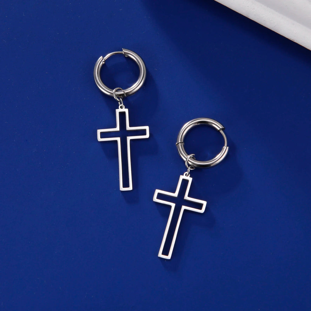 Silver hoop earrings with cross pendants on a blue background
