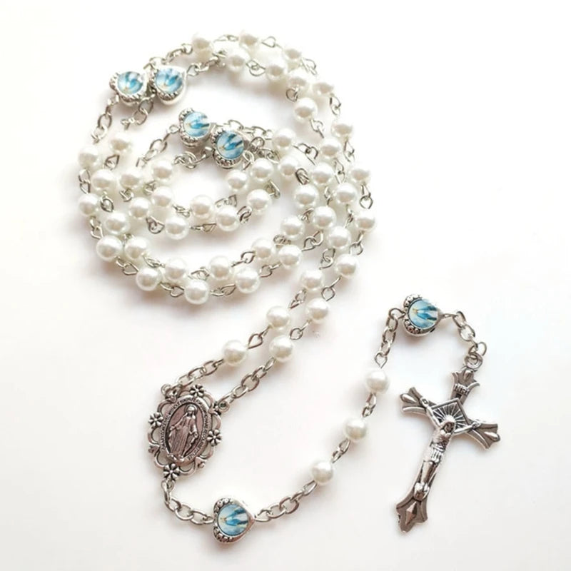 White rosary with silver and blue accents on a white background