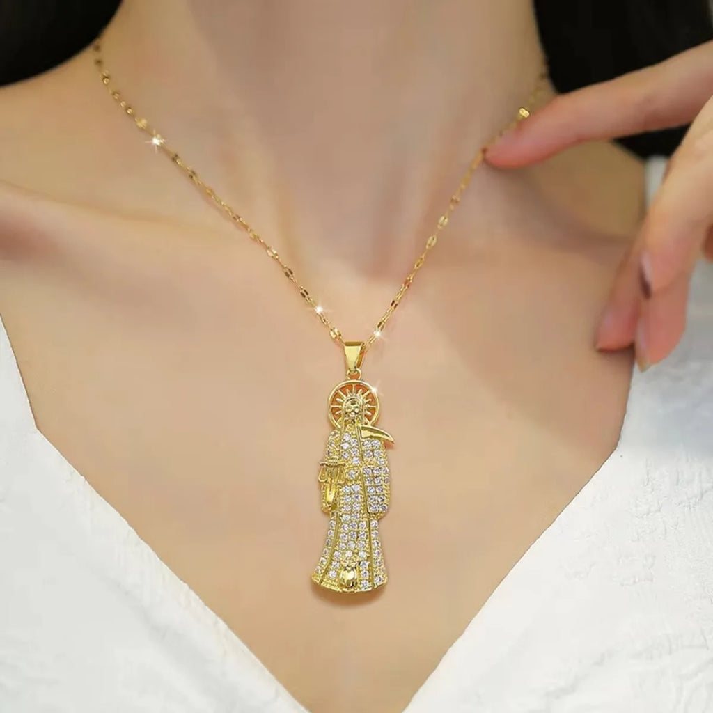 Gold necklace with a detailed pendant on a mannequin
