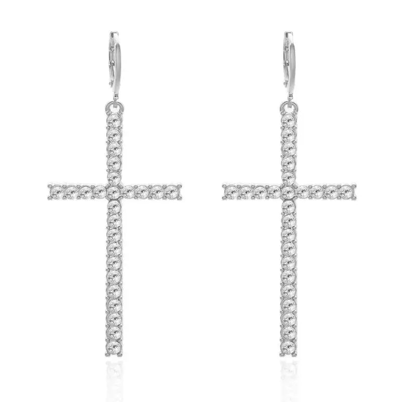 Silver cross-shaped earrings on a white background