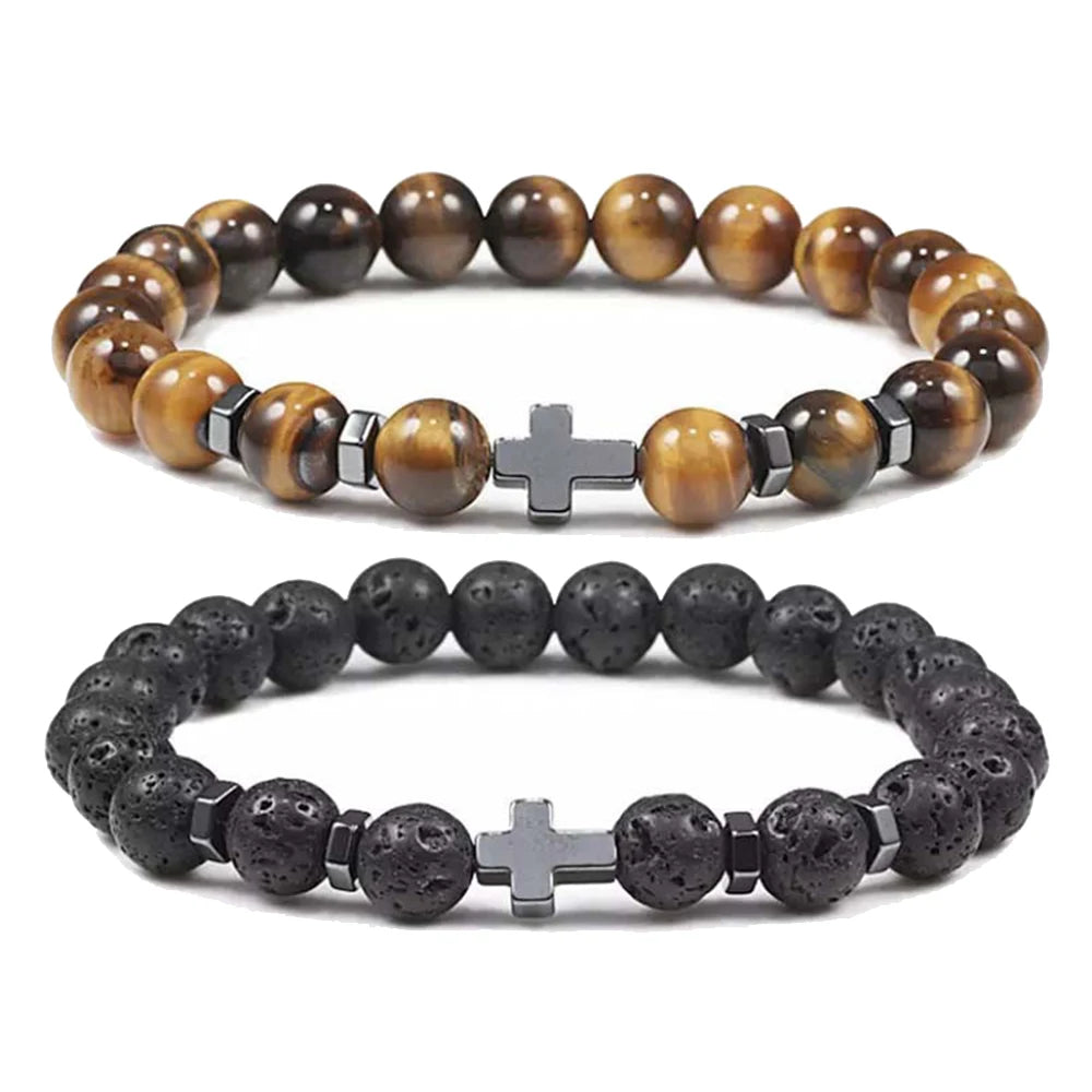 Two beaded bracelets with cross charms on a white background