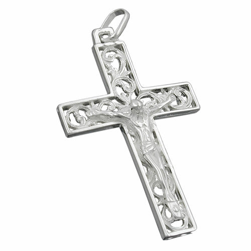 Silver cross pendant with intricate designs on a white background
