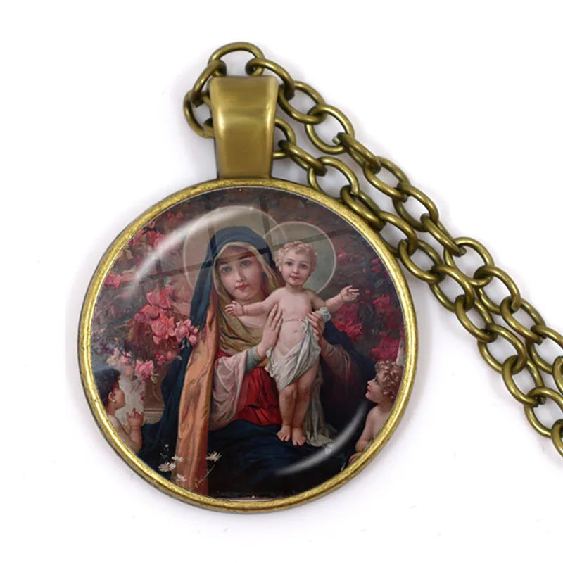 Necklace with pendant featuring a religious scene of a woman holding a child, on a white background.