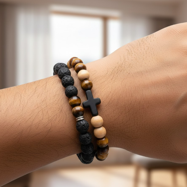 Close-up of a wrist wearing two beaded bracelets with a blurred background