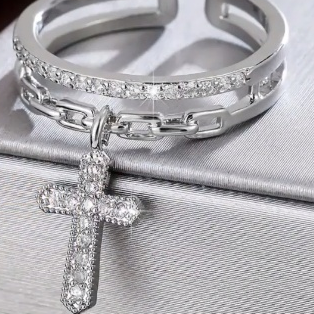 Silver ring with a cross pendant, sound charged