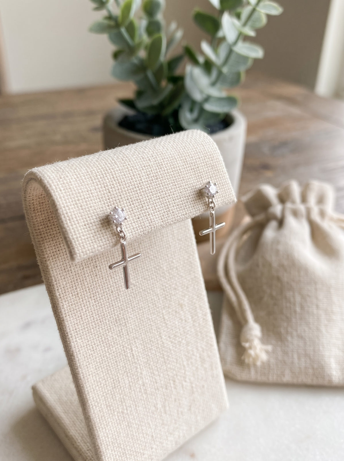 Radiant Star and Cross Drop Earrings