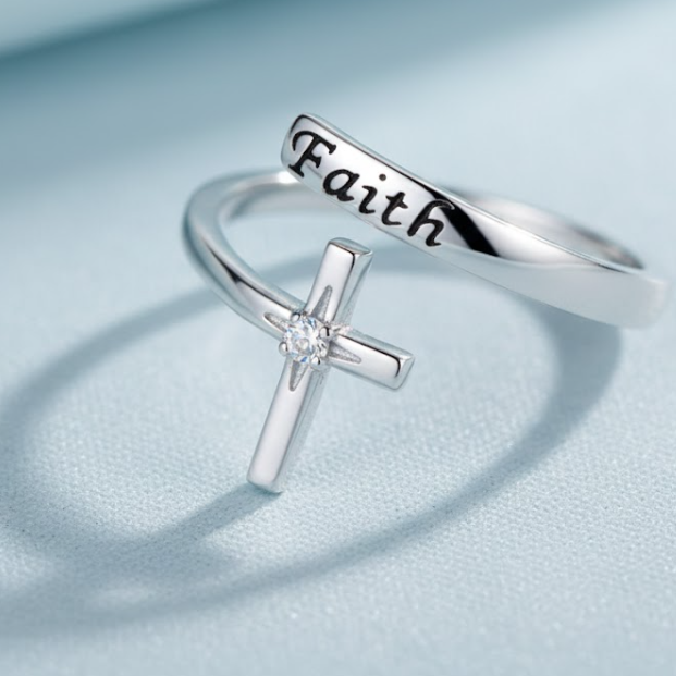 Close-up of the Eternal Focus Silver Faith Scripture Cross Ring, an adjustable stainless steel open-wrap ring inscribed with 'Faith' and set with a central Cubic Zirconia stone. Minimalist spiritual Jewellery, sound-charged, Australia, RuHa Spirit