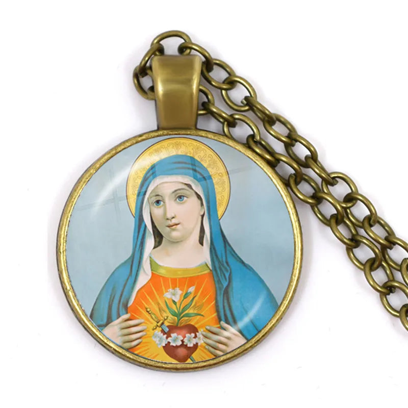 Pendant with religious iconography on a chain against a white background