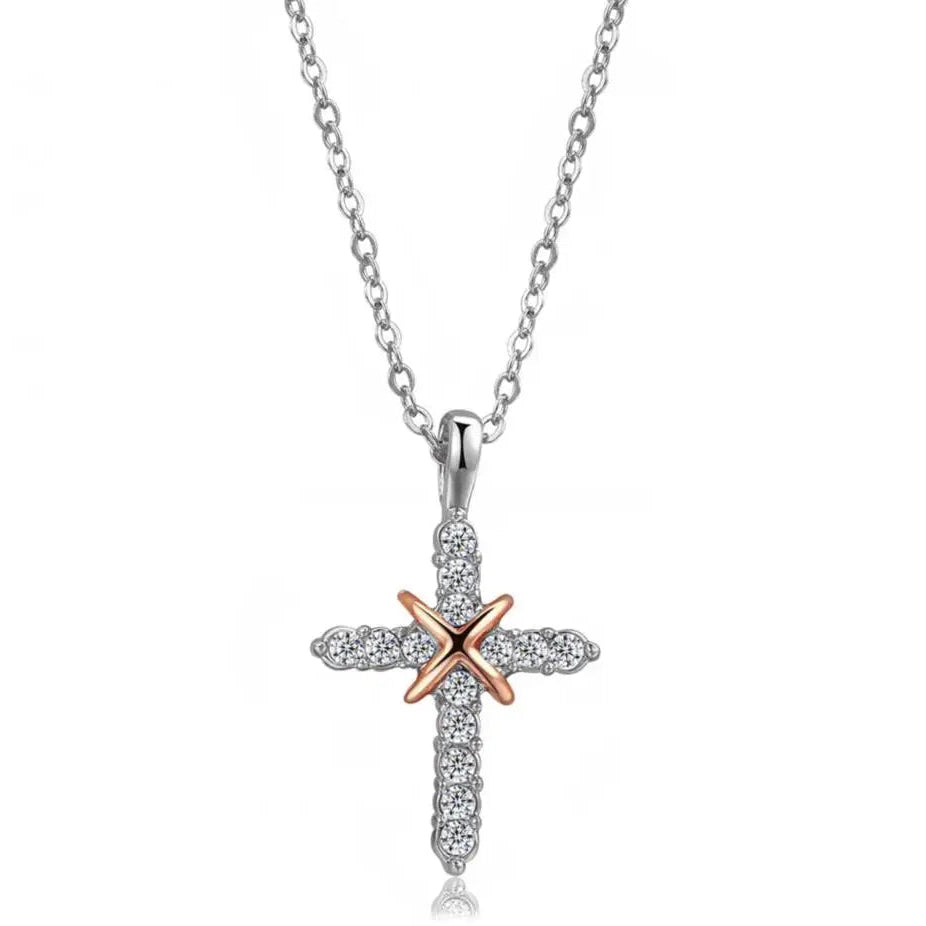 Cross-shaped pendant with rose gold and silver finish on a white background