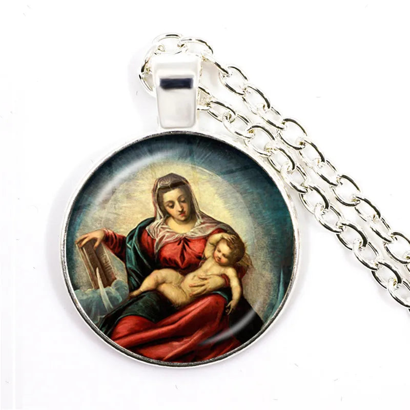 Pendant with a religious scene of a woman holding a child on a white background