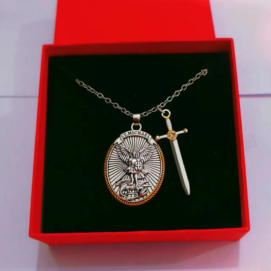 Silver necklace with pendant and sword in a red box