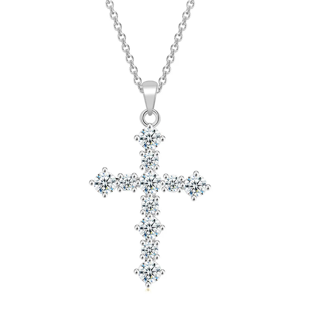 Silver cross pendant necklace on a white background