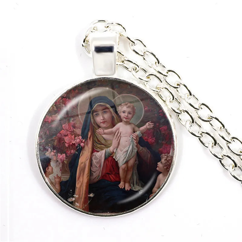 Pendant with religious design of a woman holding a child on a white background