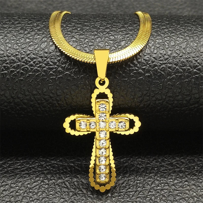 Gold cross pendant with diamonds on a black textured background