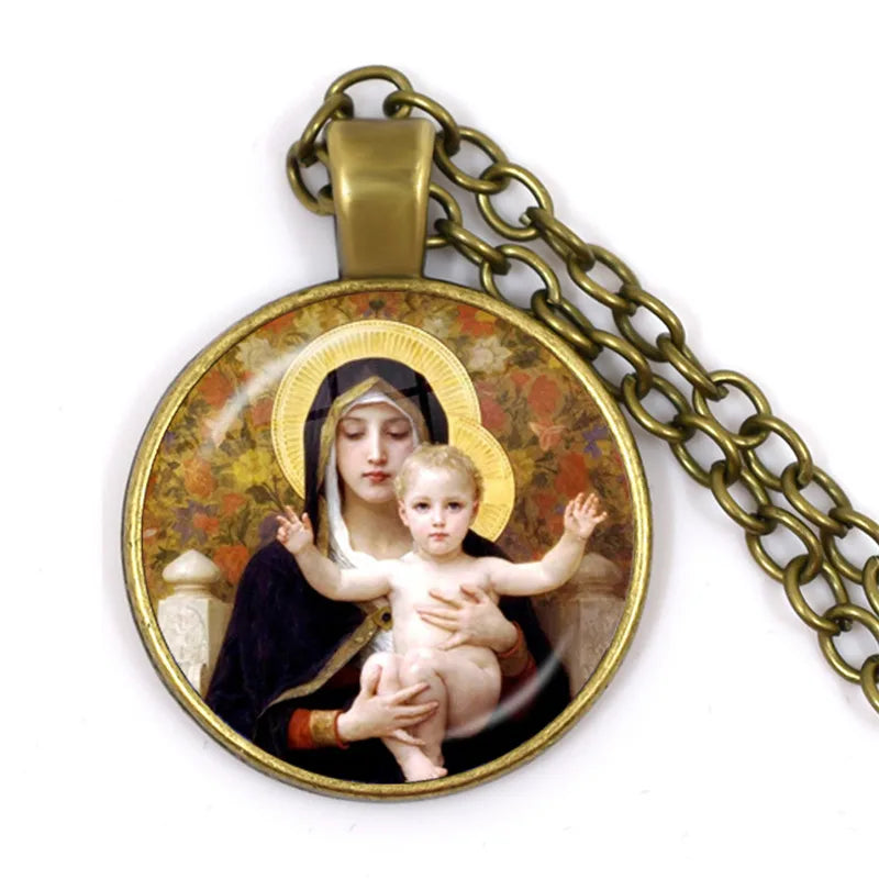 Pendant with religious design of a woman holding a child on a white background