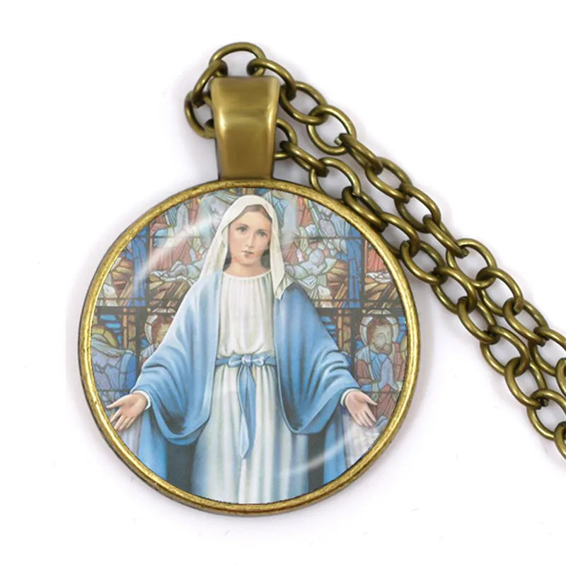 Pendant with a religious design of a woman in a blue robe on a white background