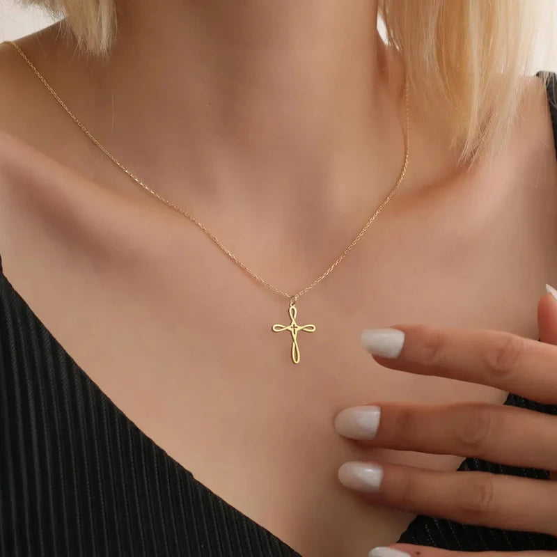 Gold colour necklace with a cross pendant, sound charged