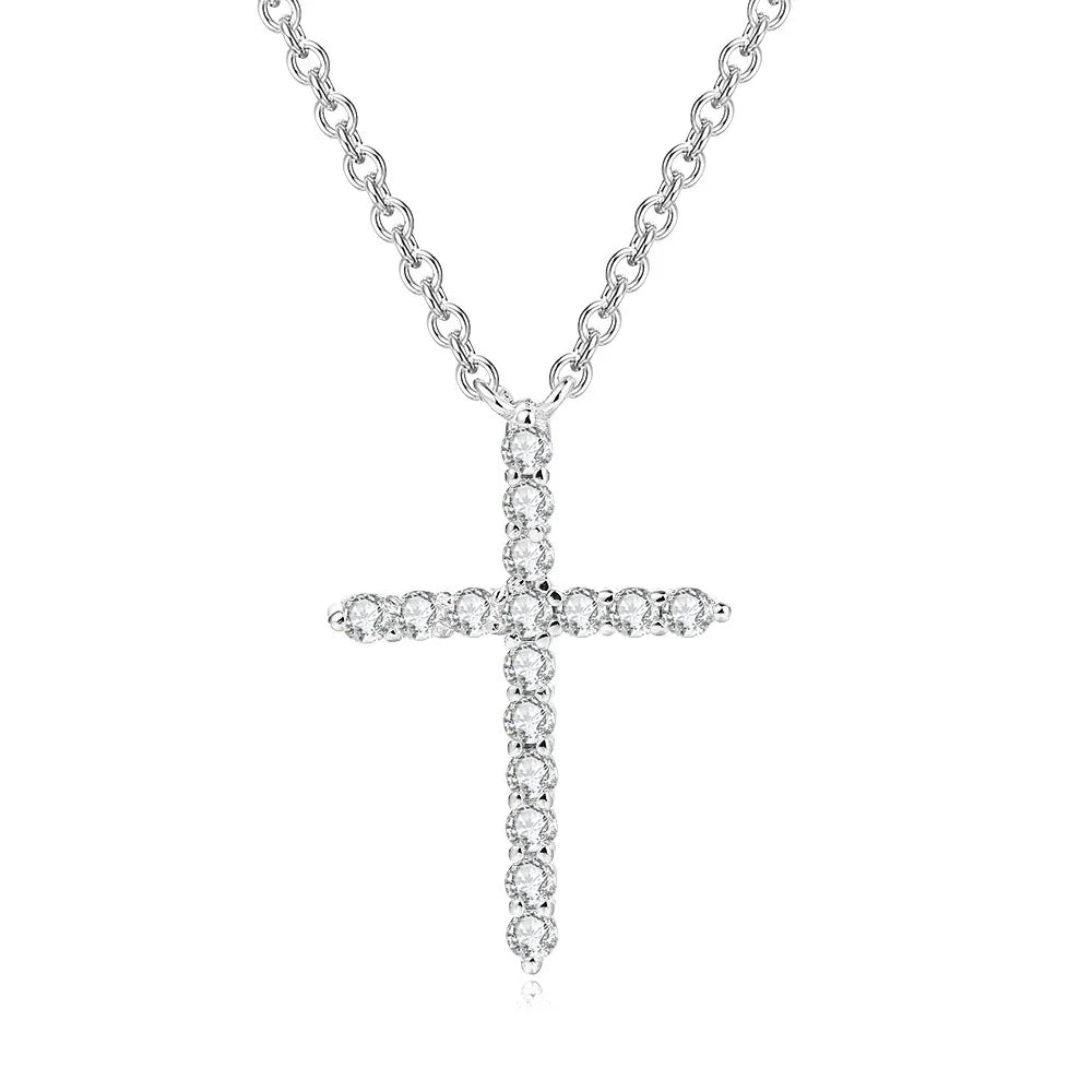 Silver cross necklace with clear stones on a white background