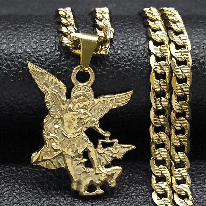 Gold angel pendant and chain on a black textured background