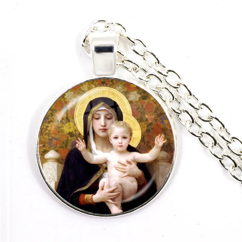 Pendant with religious design of a woman holding a child on a white background