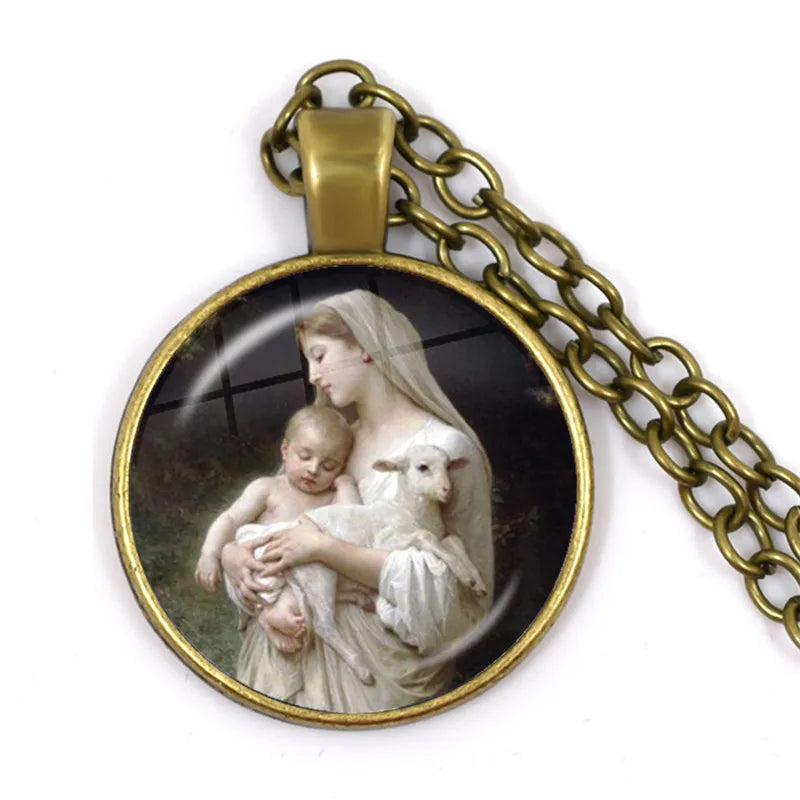 Pendant with a religious scene of a woman holding a child and a lamb, on a white background.