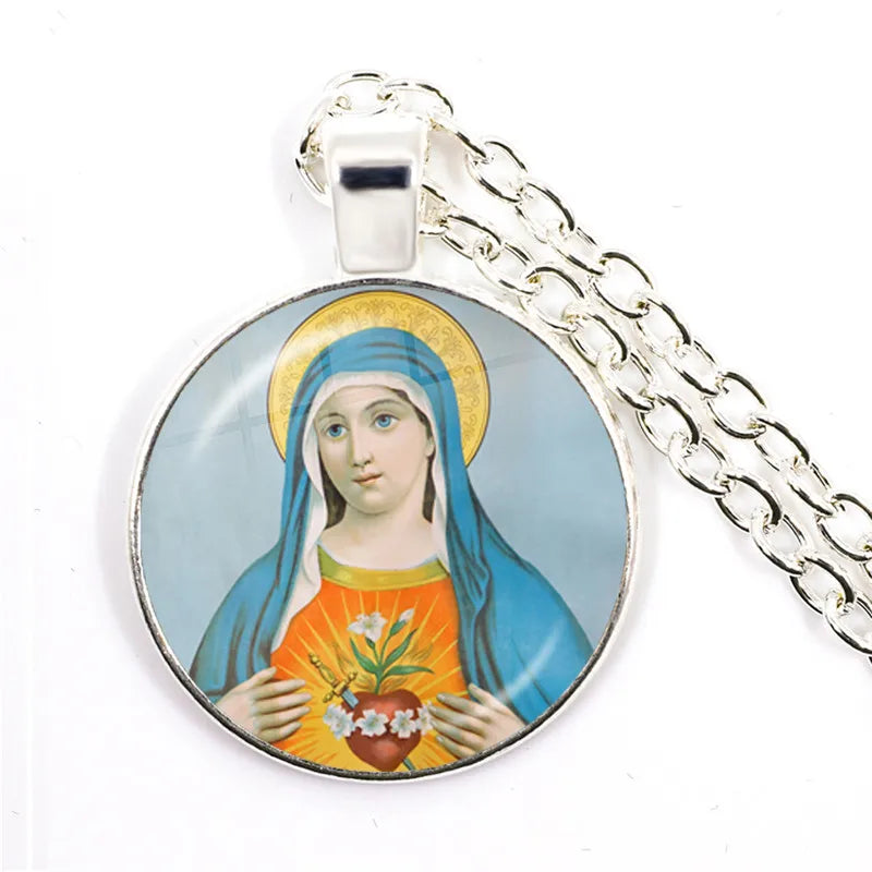 Pendant with religious design on a chain against a white background