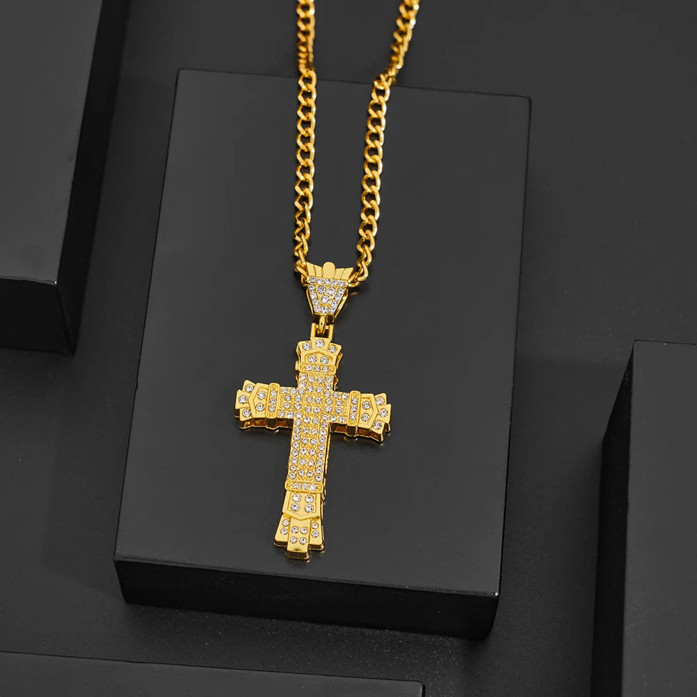 Gold cross pendant necklace on a black background