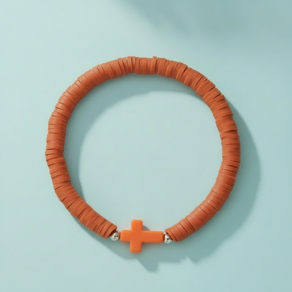 Orange beaded Everyday Faith pastel Heishi bead stretchy bracelet with a subtle acrylic cross charm, featuring soft pink, apricot, and mint green polymer clay beads. Ideal casual spiritual Jewellery for stacking, sound charged, Australian, RuHa Spirit, Rapid Delivery