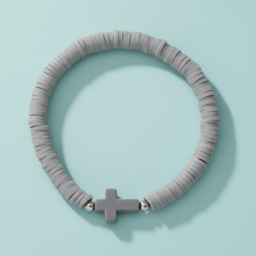 Grey beaded Everyday Faith pastel Heishi bead stretchy bracelet with a subtle acrylic cross charm, featuring soft pink, apricot, and mint green polymer clay beads. Ideal casual spiritual Jewellery for stacking, sound charged, Australian, RuHa Spirit, Rapid Delivery