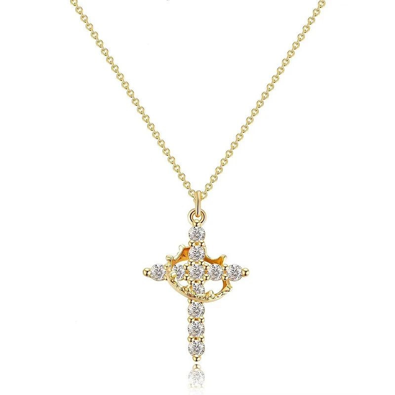 Gold cross necklace with diamonds on a white background